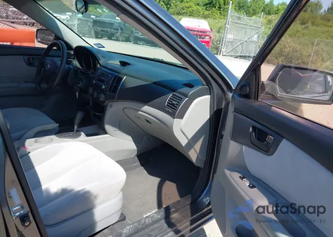 2009 Kia Optima Lx z USA, uszkodzony, nr VIN KNAGE228X95293983